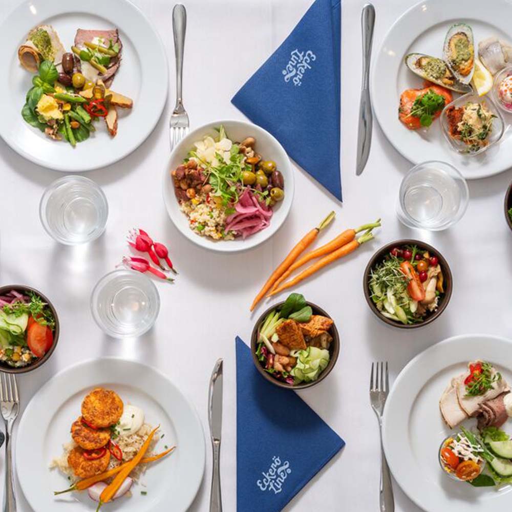 Dinner plate with gourmet meal and a glass of wine