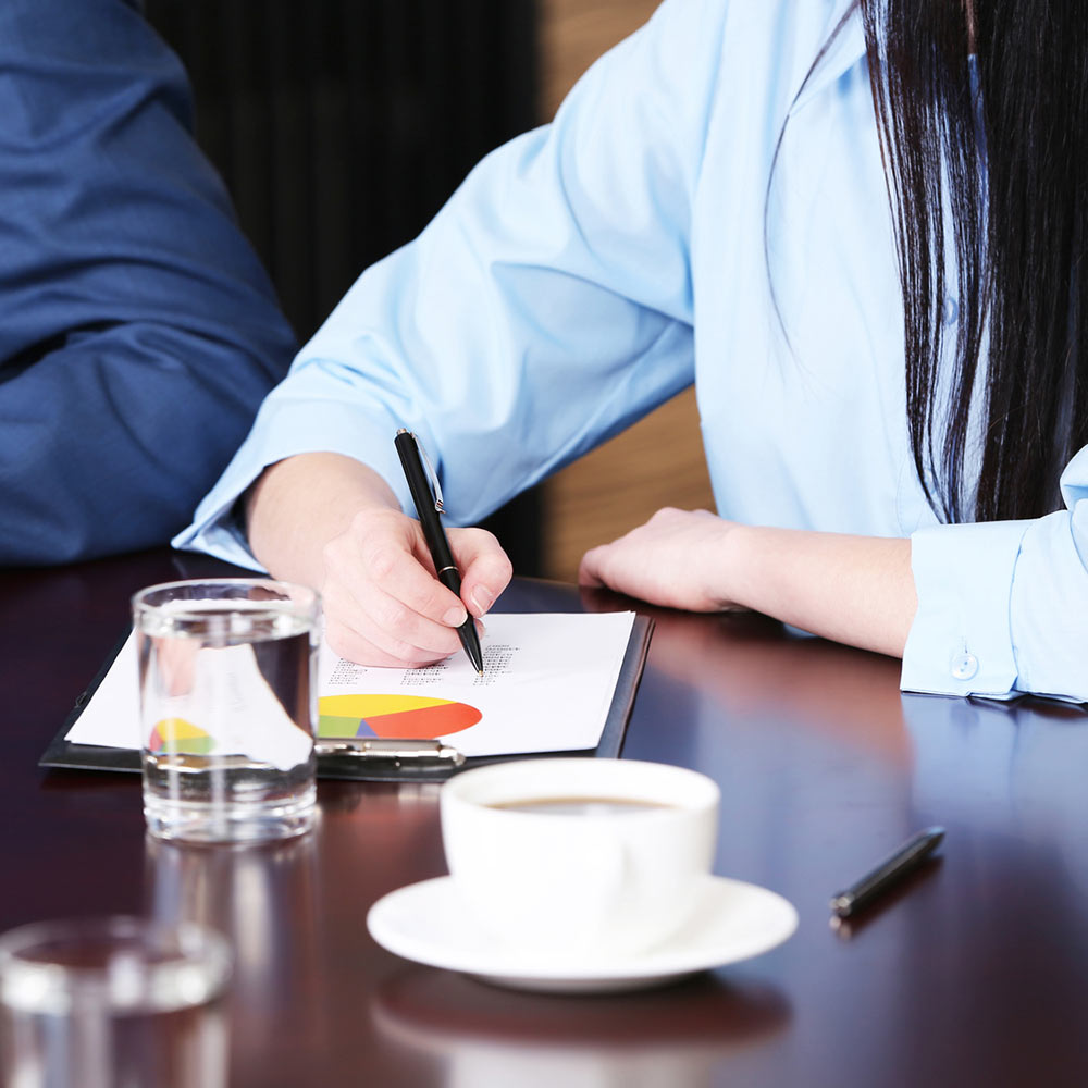 Woman writing notes.